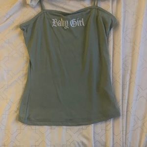 2 tops one white with flowers the other bluish green that says baby girl